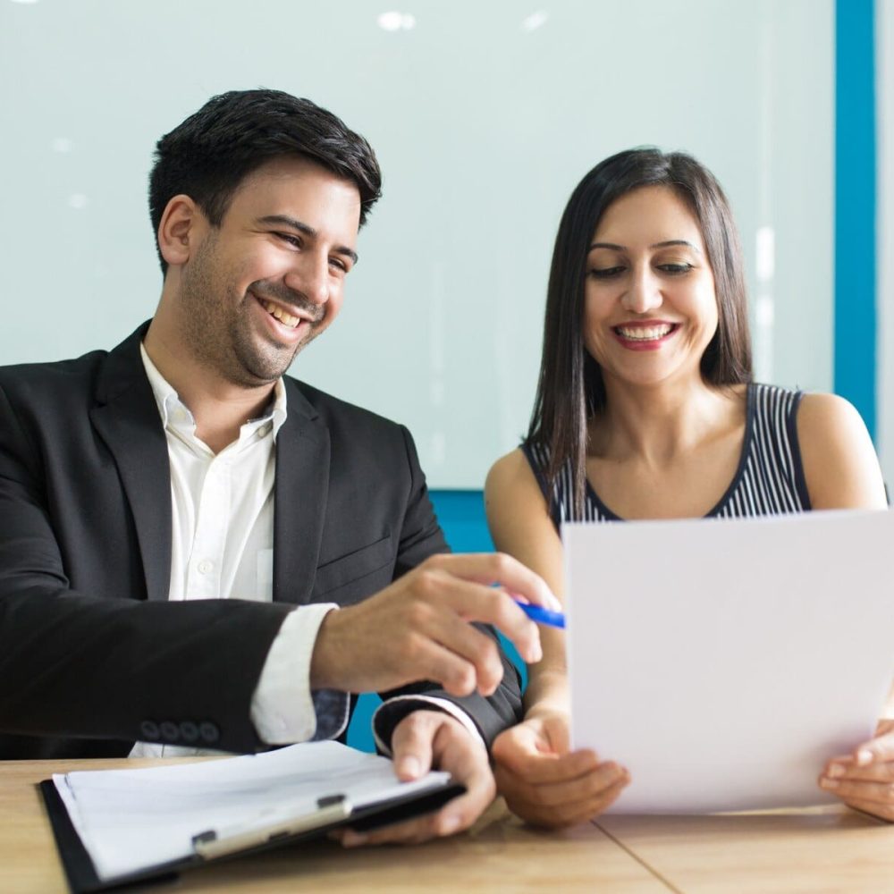 positive-business-executives-laughing-while-reading-contract_1262-18019_5_11zon